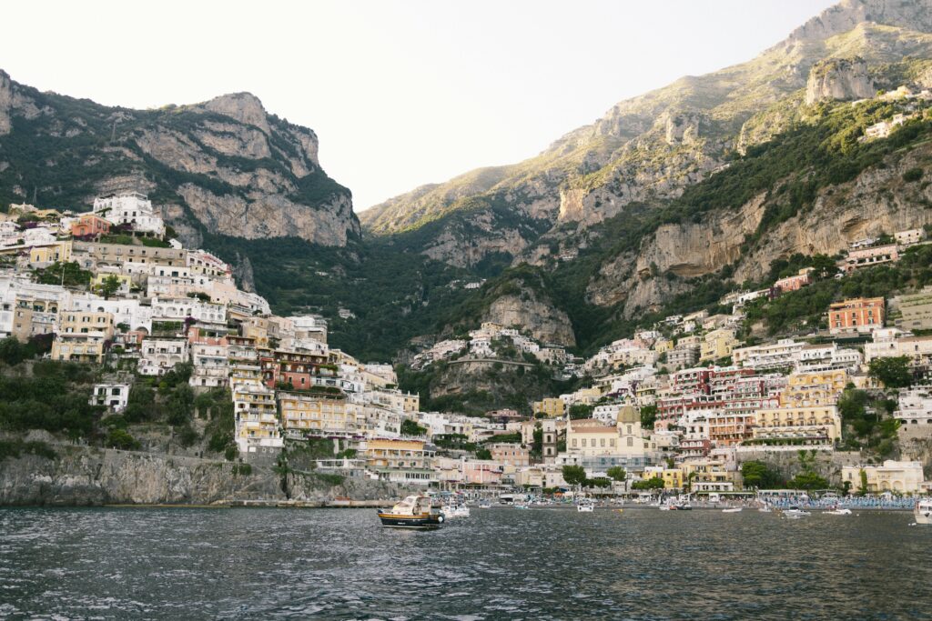 Harbor in Small Town with Buildings on Rocky Slope Cliff